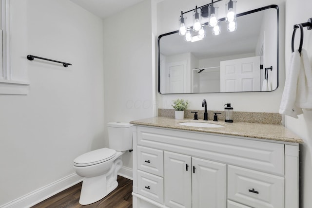 638 E 6th Ave, Lancaster, OH 43130 - bathroom featuring vanity, wood finished floors, and a shower