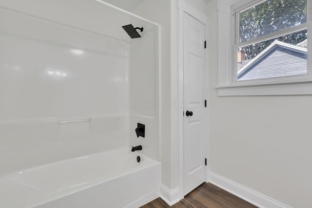 638 E 6th Ave, Lancaster, OH 43130 - bathroom with wood finished floors and shower / bathtub combination