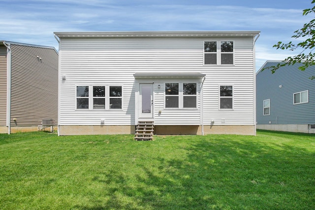 120 Heron Ave, Pataskala, OH 43062 - rear view of house with entry steps and a lawn