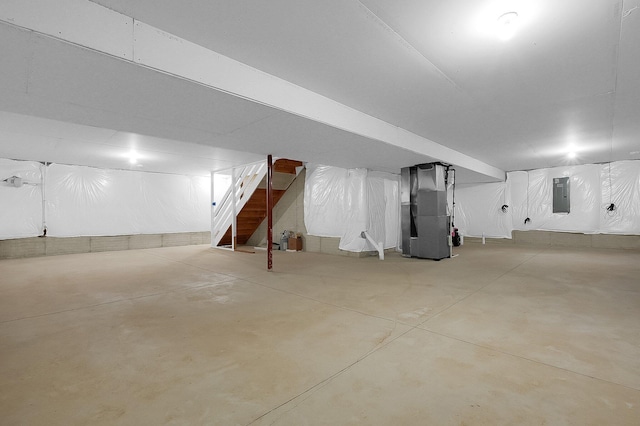 120 Heron Ave, Pataskala, OH 43062 - below grade area with electric panel, heating unit, and stairs