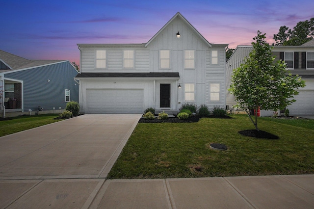 120 Heron Ave, Pataskala, OH 43062 - traditional-style home with board and batten siding, concrete driveway, a lawn, and an attached garage