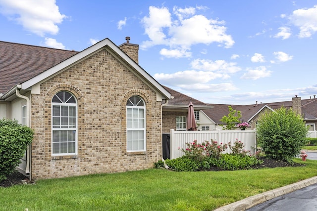 305 Pointe Pl Unit 12, Westerville, OH 43082 - ranch-style home featuring a chimney, brick siding, a front lawn, and roof with shingles