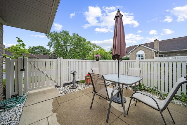 305 Pointe Pl Unit 12, Westerville, OH 43082 - view of patio with a gate and outdoor dining area