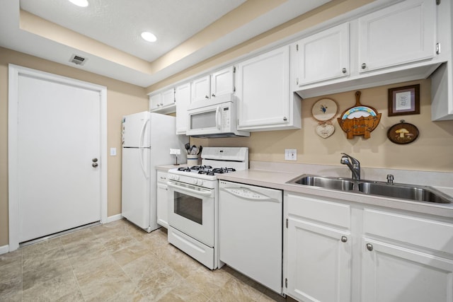 305 Pointe Pl Unit 12, Westerville, OH 43082 - kitchen with white appliances, a sink, white cabinetry, light countertops, and baseboards