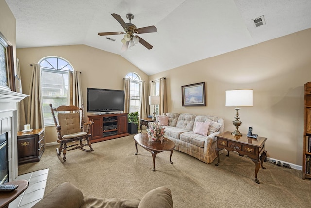 305 Pointe Pl Unit 12, Westerville, OH 43082 - living room featuring light colored carpet, vaulted ceiling, a fireplace with flush hearth, ceiling fan, and baseboards