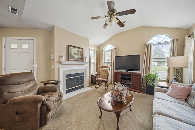 305 Pointe Pl Unit 12, Westerville, OH 43082 - living room featuring light colored carpet, ceiling fan, a tile fireplace, and vaulted ceiling