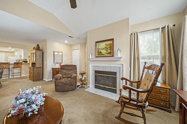 305 Pointe Pl Unit 12, Westerville, OH 43082 - living room with carpet flooring, a tile fireplace, vaulted ceiling, and a ceiling fan