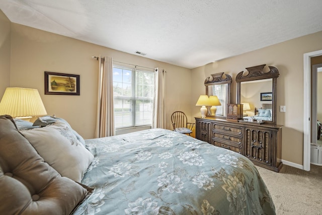 305 Pointe Pl Unit 12, Westerville, OH 43082 - carpeted bedroom featuring baseboards and a textured ceiling