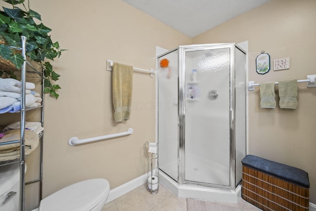 305 Pointe Pl Unit 12, Westerville, OH 43082 - bathroom featuring a stall shower, tile patterned floors, toilet, baseboards, and a textured ceiling