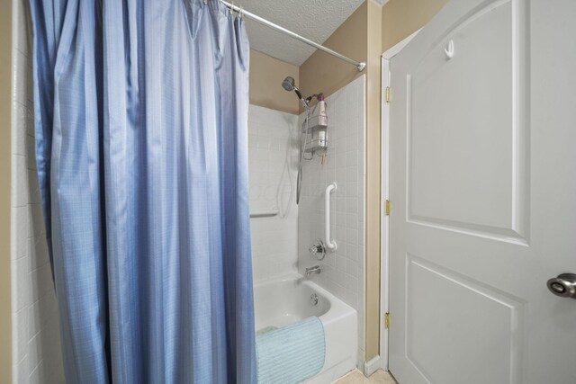 305 Pointe Pl Unit 12, Westerville, OH 43082 - bathroom with shower / tub combo and a textured ceiling