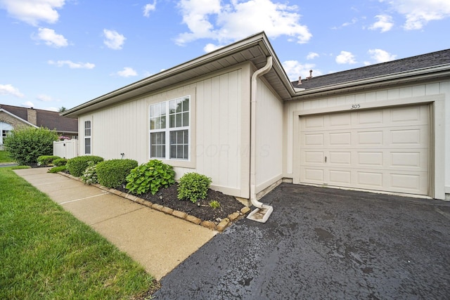 305 Pointe Pl Unit 12, Westerville, OH 43082 - view of property exterior featuring an attached garage and driveway