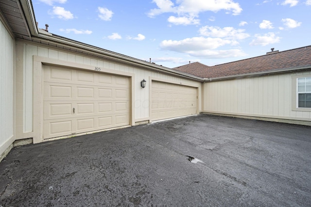 305 Pointe Pl Unit 12, Westerville, OH 43082 - garage featuring driveway