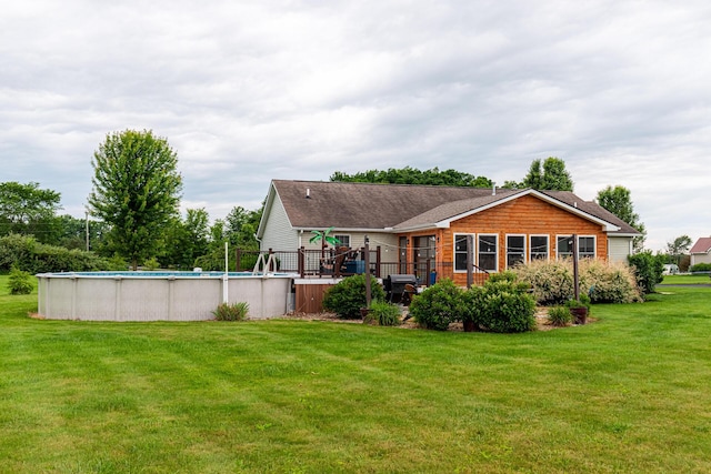 4091 Township Road 21, Marengo, OH 43334 - back of house featuring a lawn, an outdoor pool, and a deck