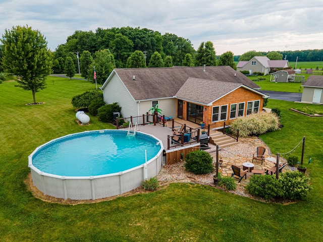 4091 Township Road 21, Marengo, OH 43334 - swimming pool featuring a wooden deck, a yard, and a patio area