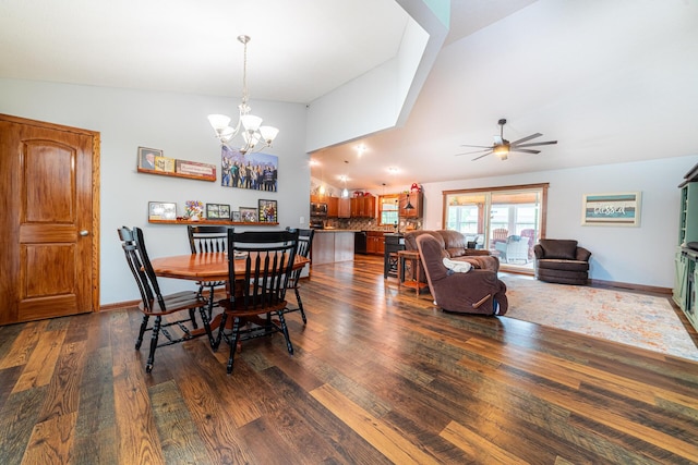 4091 Township Road 21, Marengo, OH 43334 - dining area with dark wood-style flooring, a ceiling fan, a chandelier, baseboards, and high vaulted ceiling