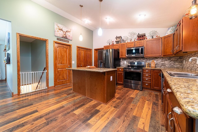 4091 Township Road 21, Marengo, OH 43334 - kitchen with stainless steel appliances, a sink, backsplash, brown cabinets, and dark wood-style flooring