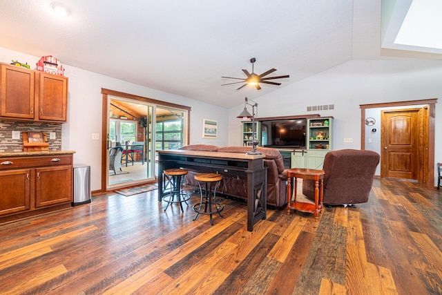4091 Township Road 21, Marengo, OH 43334 - living room featuring dark wood-style flooring, vaulted ceiling, and ceiling fan
