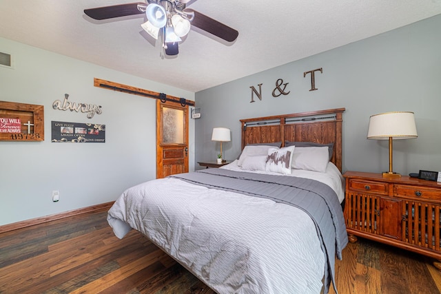 4091 Township Road 21, Marengo, OH 43334 - bedroom with a barn door, wood finished floors, ceiling fan, and baseboards