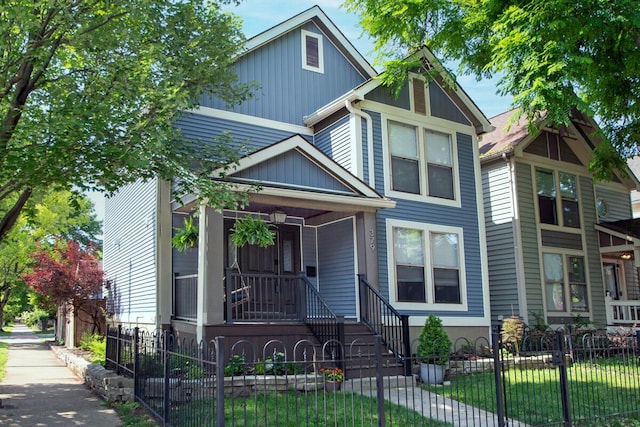 379 W 4th Ave, Columbus, OH 43201 - view of front facade with covered porch and a fenced front yard
