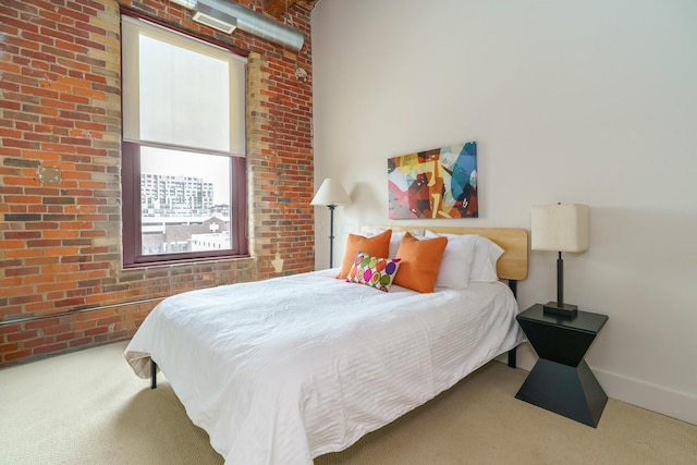 150 E Main St Unit 405, Columbus, OH 43215 - bedroom featuring carpet floors and brick wall
