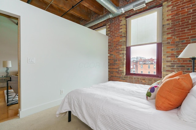 150 E Main St Unit 405, Columbus, OH 43215 - carpeted bedroom with brick wall