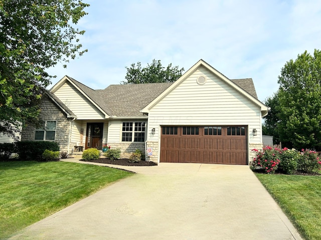 2461 Abbey Knoll Dr, Lewis Center, OH 43035 - view of front facade featuring stone siding, a garage, driveway, a front yard, and roof with shingles