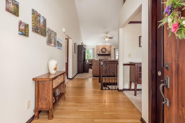 2461 Abbey Knoll Dr, Lewis Center, OH 43035 - entrance foyer featuring a ceiling fan, light wood-style flooring, lofted ceiling, and a fireplace