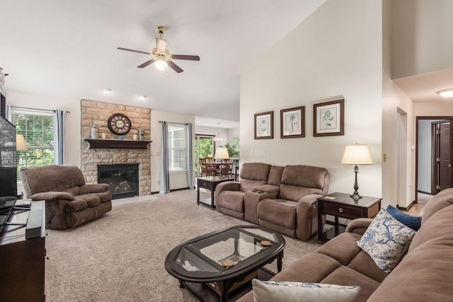 2461 Abbey Knoll Dr, Lewis Center, OH 43035 - living room with carpet flooring, a ceiling fan, high vaulted ceiling, and a stone fireplace