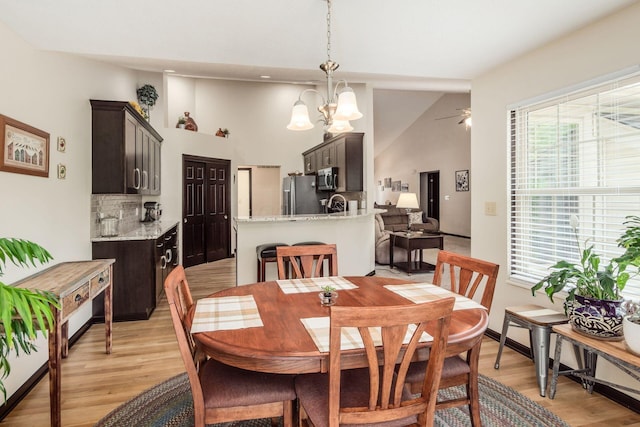 2461 Abbey Knoll Dr, Lewis Center, OH 43035 - dining room with light wood-style flooring, a chandelier, and ceiling fan
