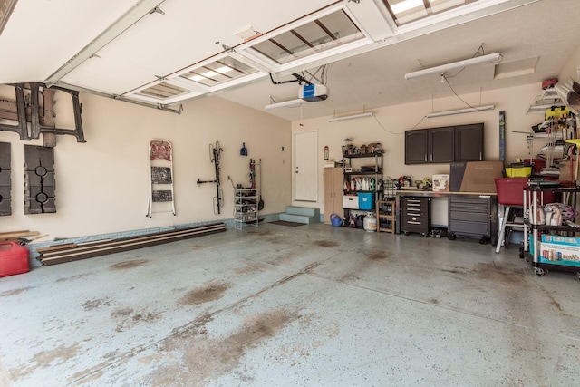 2461 Abbey Knoll Dr, Lewis Center, OH 43035 - garage featuring a workshop area and a garage door opener