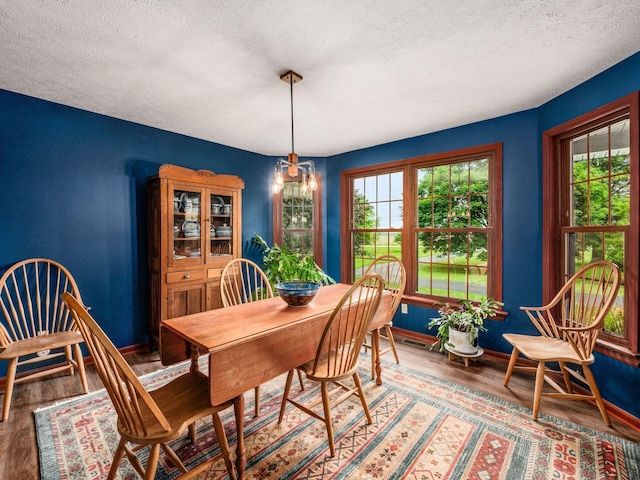 8120 Morgan Rd, West Jefferson, OH 43162 - dining area featuring a textured ceiling and wood finished floors