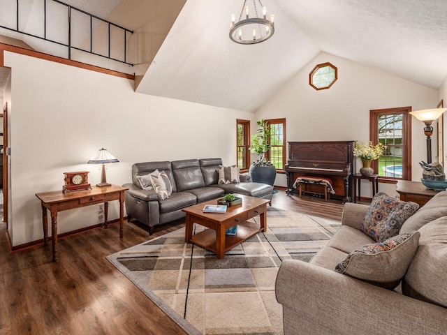 8120 Morgan Rd, West Jefferson, OH 43162 - living area featuring wood finished floors, high vaulted ceiling, and a chandelier