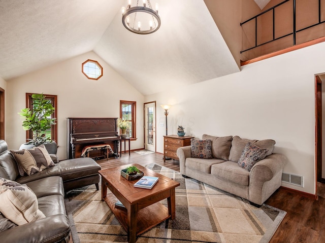 8120 Morgan Rd, West Jefferson, OH 43162 - living area featuring wood finished floors, a chandelier, and high vaulted ceiling