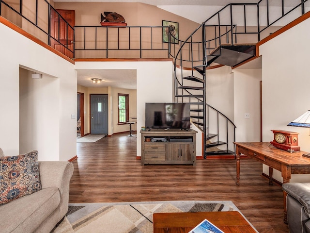 8120 Morgan Rd, West Jefferson, OH 43162 - living room featuring stairway, wood finished floors, and a towering ceiling
