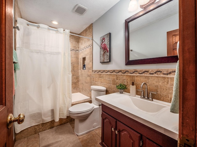 8120 Morgan Rd, West Jefferson, OH 43162 - bathroom with vanity, tile walls, shower / tub combo, and a wainscoted wall