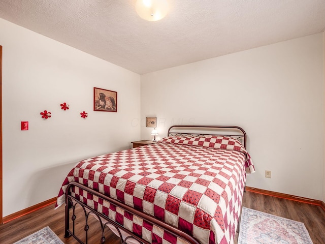 8120 Morgan Rd, West Jefferson, OH 43162 - bedroom featuring wood finished floors and a textured ceiling