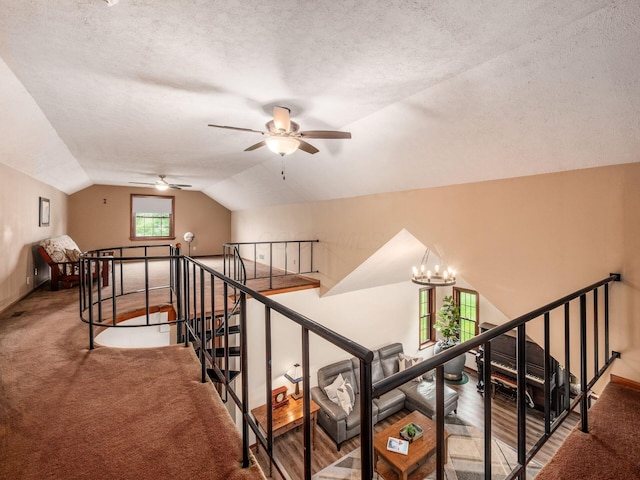 8120 Morgan Rd, West Jefferson, OH 43162 - stairway featuring a ceiling fan, vaulted ceiling, a textured ceiling, and a chandelier