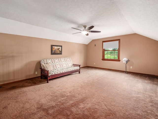 8120 Morgan Rd, West Jefferson, OH 43162 - living area featuring vaulted ceiling, light colored carpet, ceiling fan, and a textured ceiling