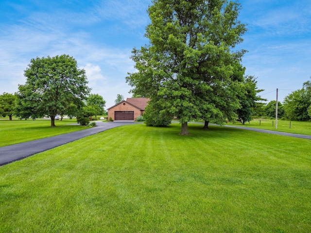 8120 Morgan Rd, West Jefferson, OH 43162 - view of property hidden behind natural elements with a front lawn and a detached garage