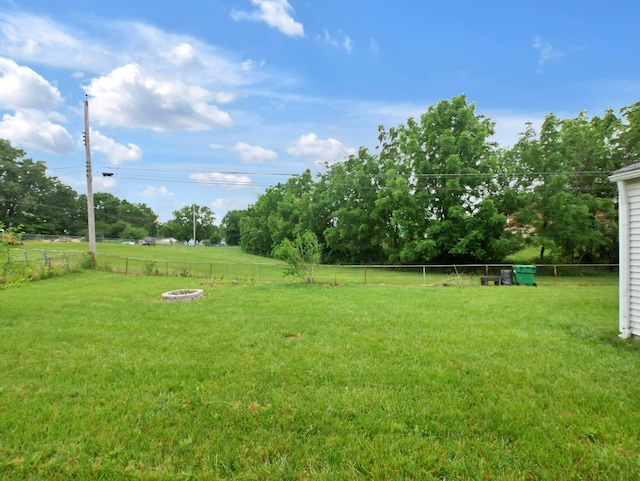 4629 Arnold Ave, Columbus, OH 43228 - fenced backyard featuring a fire pit