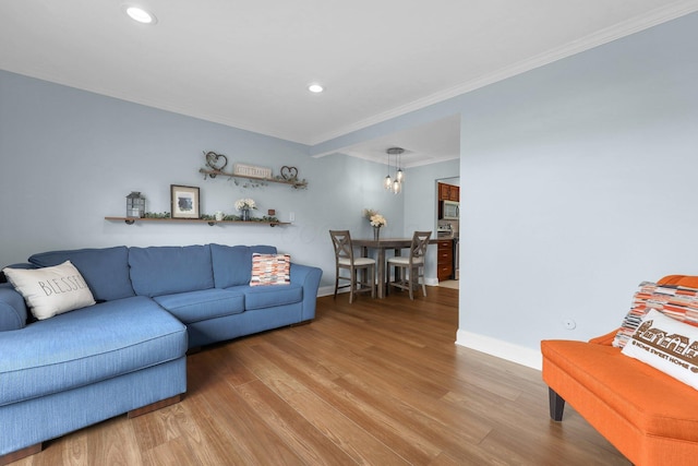 1365 Bluff Ave Unit B, Columbus, OH 43212 - living room with ornamental molding, wood finished floors, recessed lighting, and a chandelier