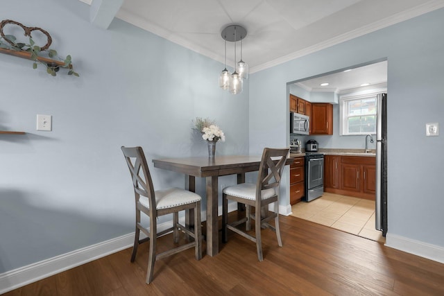 1365 Bluff Ave Unit B, Columbus, OH 43212 - dining room featuring light wood-style floors and crown molding