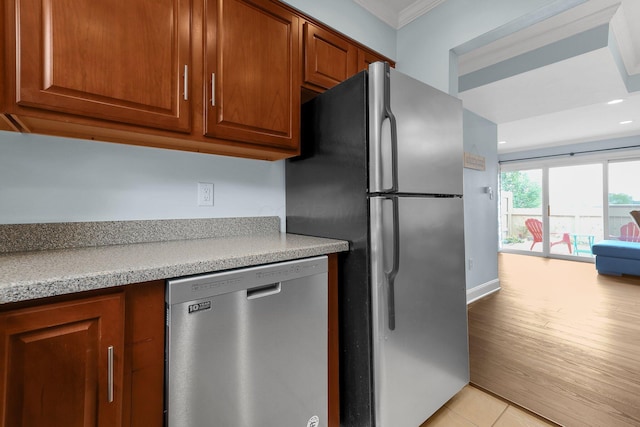 1365 Bluff Ave Unit B, Columbus, OH 43212 - kitchen featuring appliances with stainless steel finishes, recessed lighting, light countertops, ornamental molding, and brown cabinets