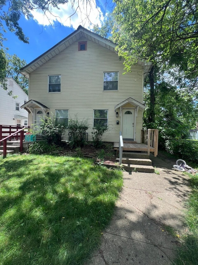 691-693 N Dawson Ave, Columbus, OH 43219 - view of front of home featuring a front yard and a wooden deck