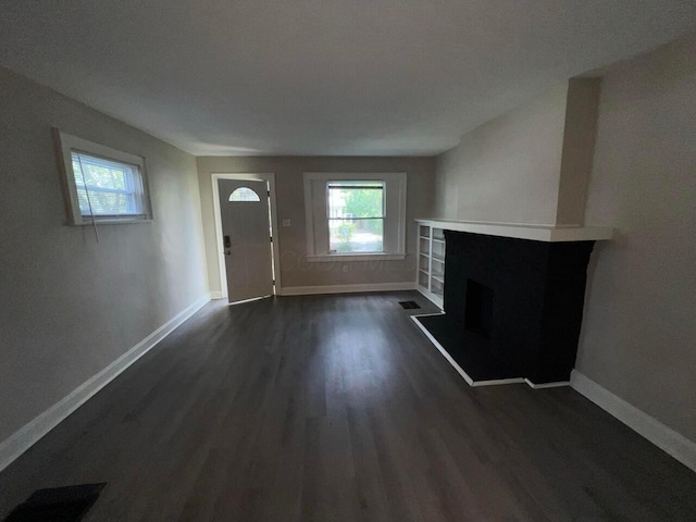 691-693 N Dawson Ave, Columbus, OH 43219 - unfurnished living room with dark wood finished floors and a fireplace