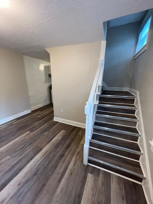 691-693 N Dawson Ave, Columbus, OH 43219 - staircase featuring wood finished floors and baseboards