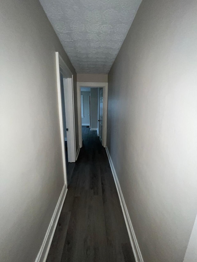 691-693 N Dawson Ave, Columbus, OH 43219 - hallway featuring dark wood-type flooring and a textured ceiling