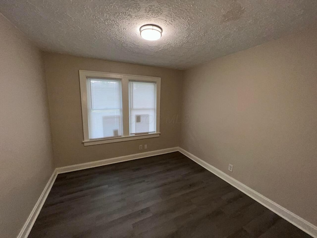 691-693 N Dawson Ave, Columbus, OH 43219 - unfurnished room featuring a textured ceiling and dark wood finished floors