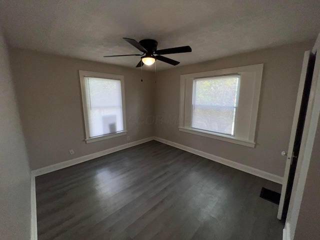 691-693 N Dawson Ave, Columbus, OH 43219 - unfurnished bedroom with dark wood-type flooring and a ceiling fan
