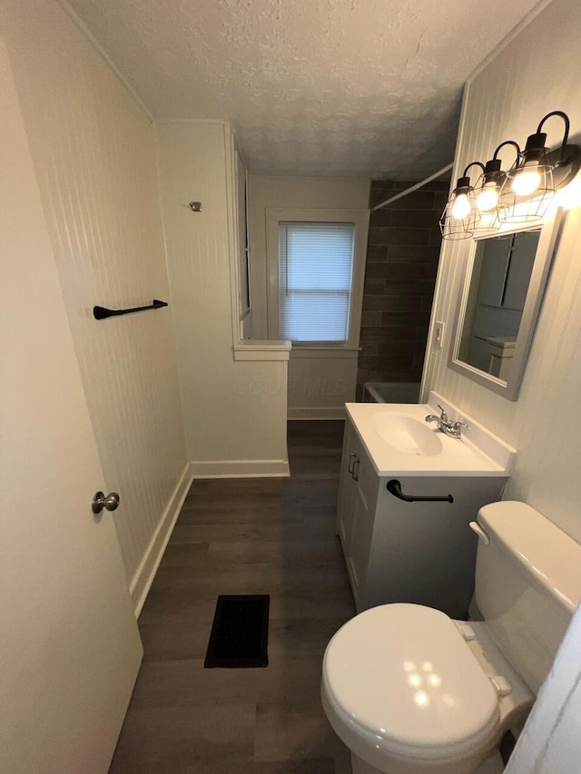 691-693 N Dawson Ave, Columbus, OH 43219 - bathroom with vanity, a textured ceiling, and wood finished floors